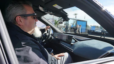 Auto Express senior test editor Dean Gibson testing BMW's augmented reality sunglasses