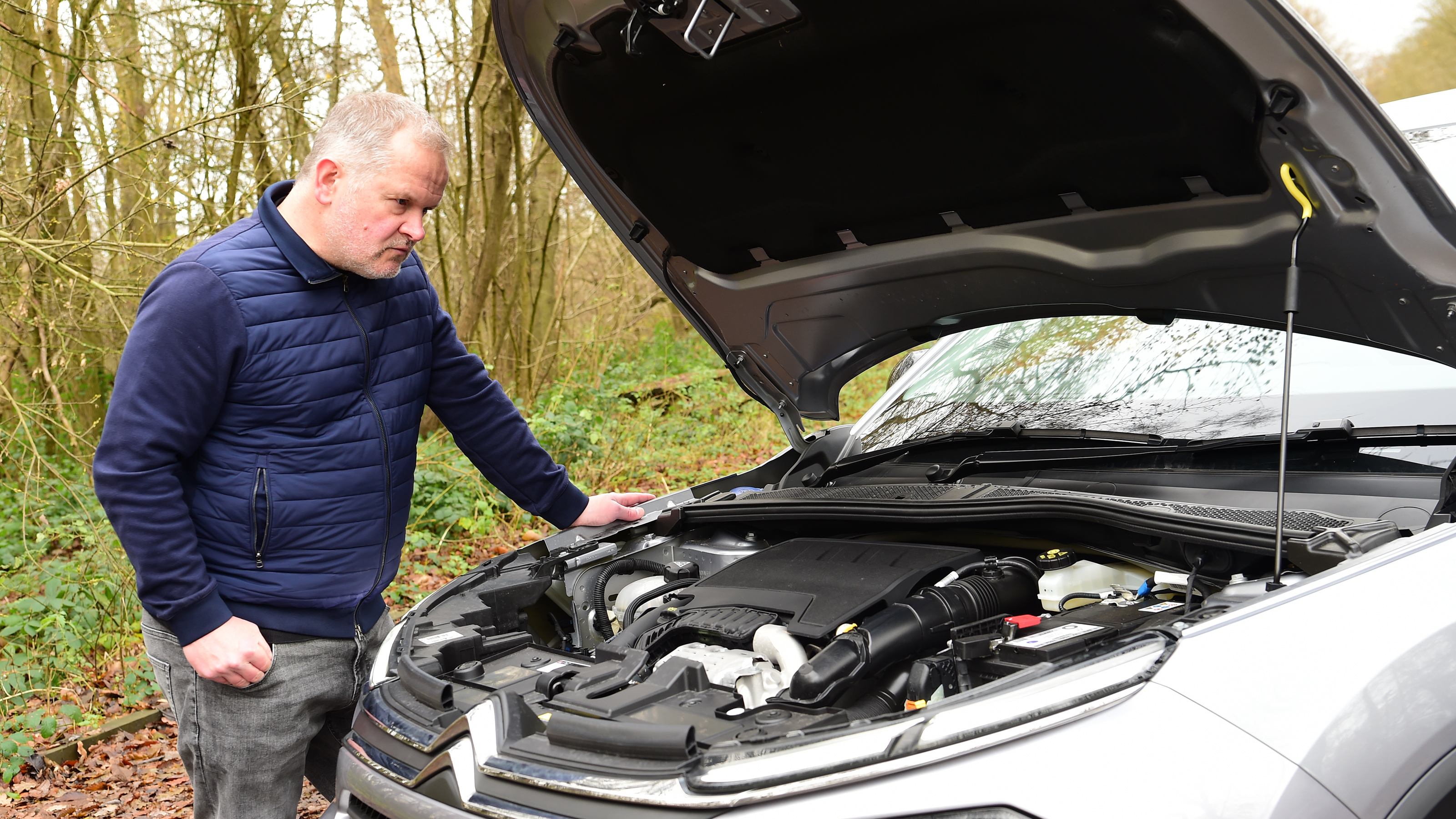 Auto Express executive editor Paul Adam inspecting the Citroen C4 X's engine bay