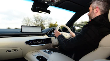 Richard Ingram driving the Genesis Electrified GV70