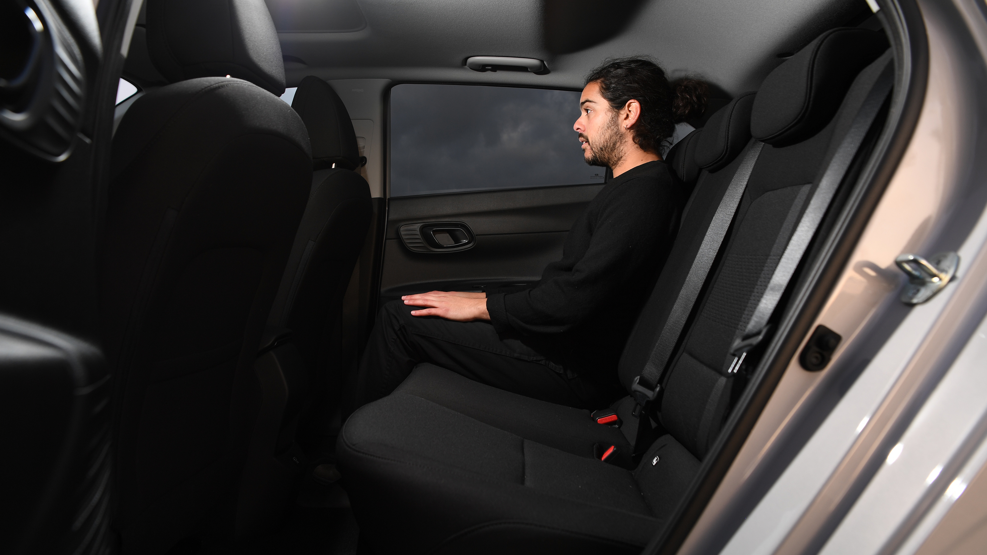 Vauxhall Corsa vs Hyundai i20 - Hyundai rear seats with Auto Express senior staff writer Jordan Katsianis 