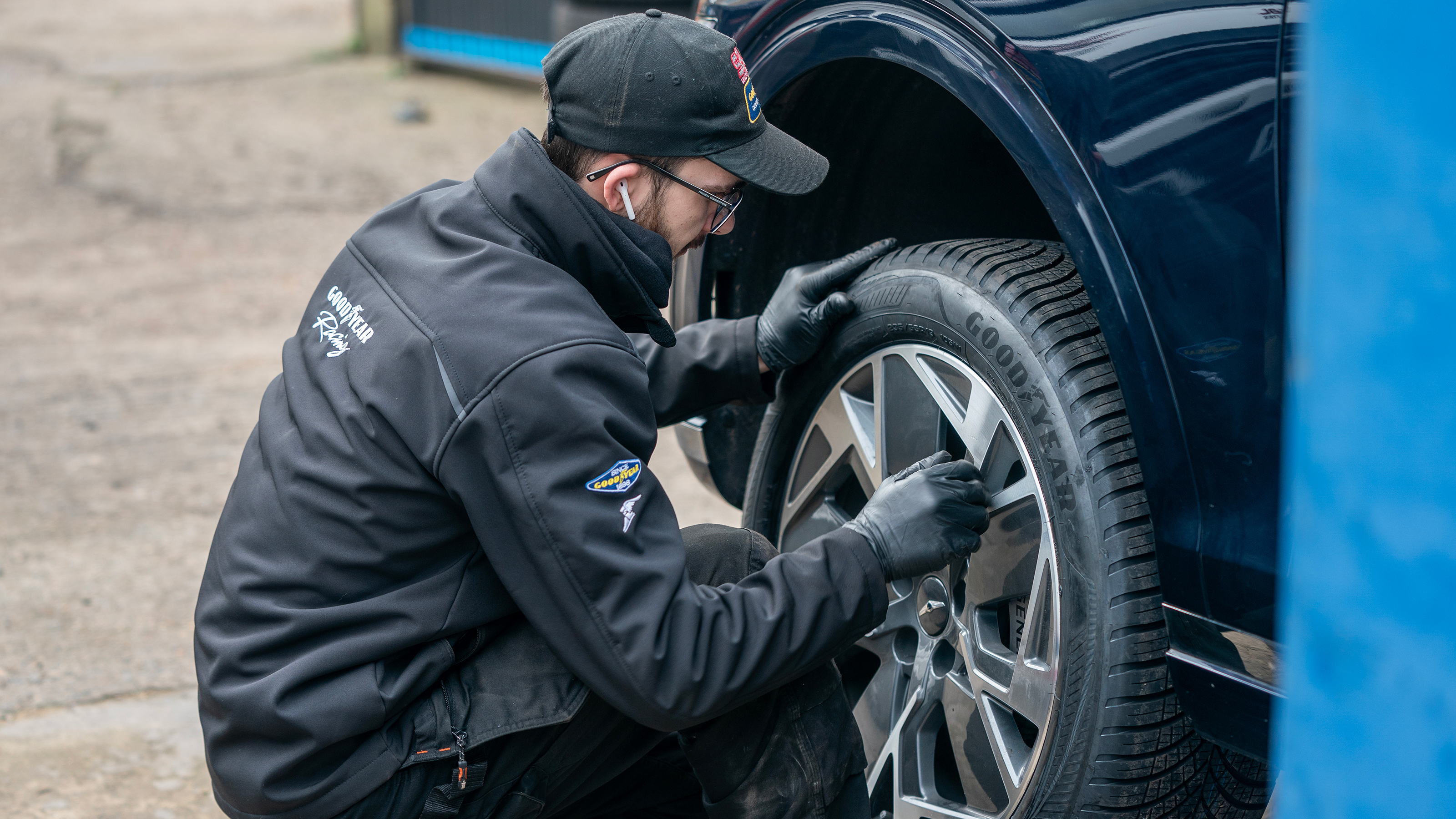 HiQ technician working on the Genesis Electrified GV70's wheel