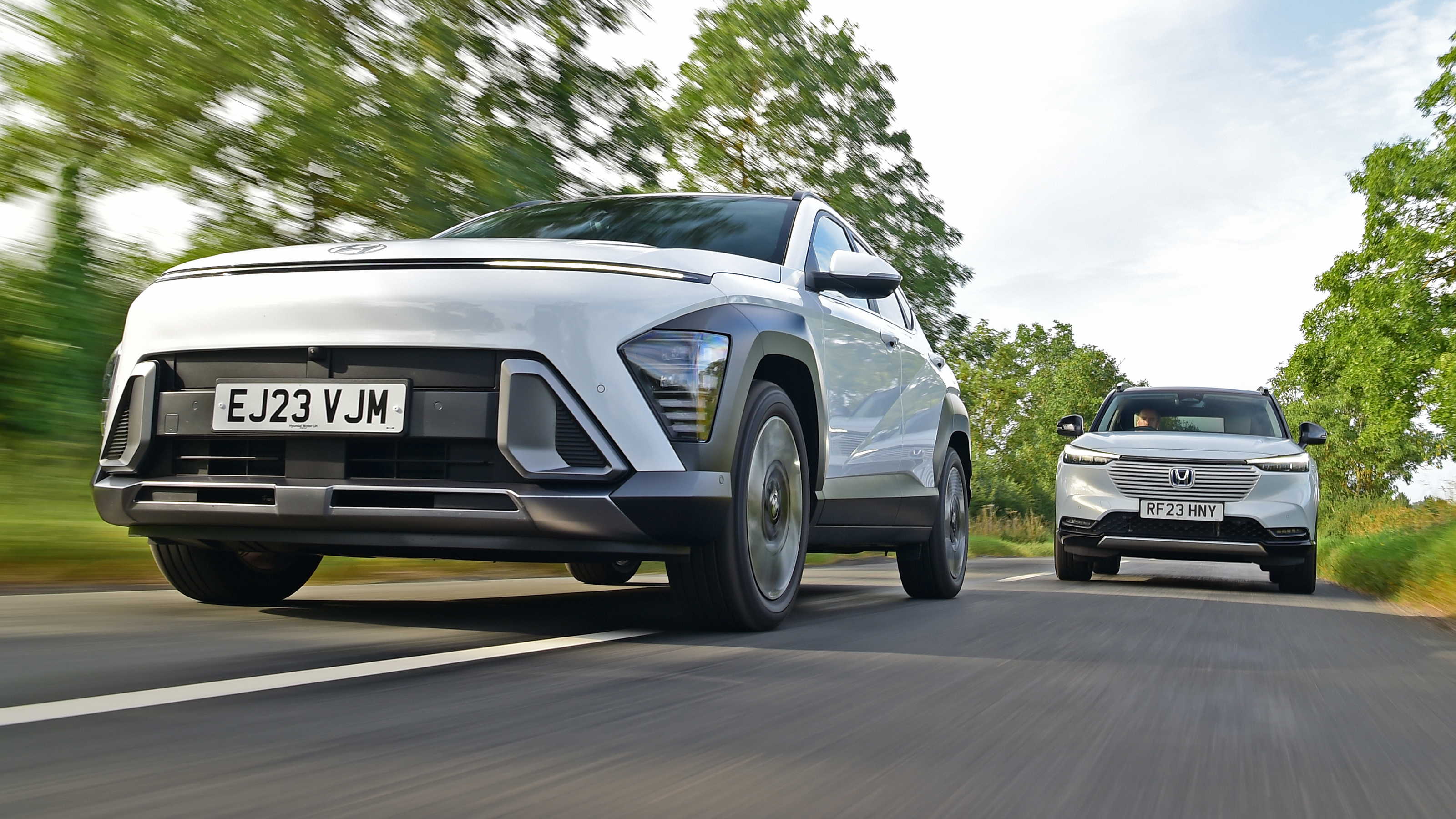 Hyundai Kona and Honda HR-V - front tracking (Hyundai leading)