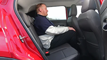 Auto Express news reporter sitting in the back seat of the Jeep Avenger Altitude+ -