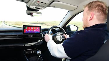 Auto Express news reporter Ellis Hyde driving the Jeep Avenger Altitude+