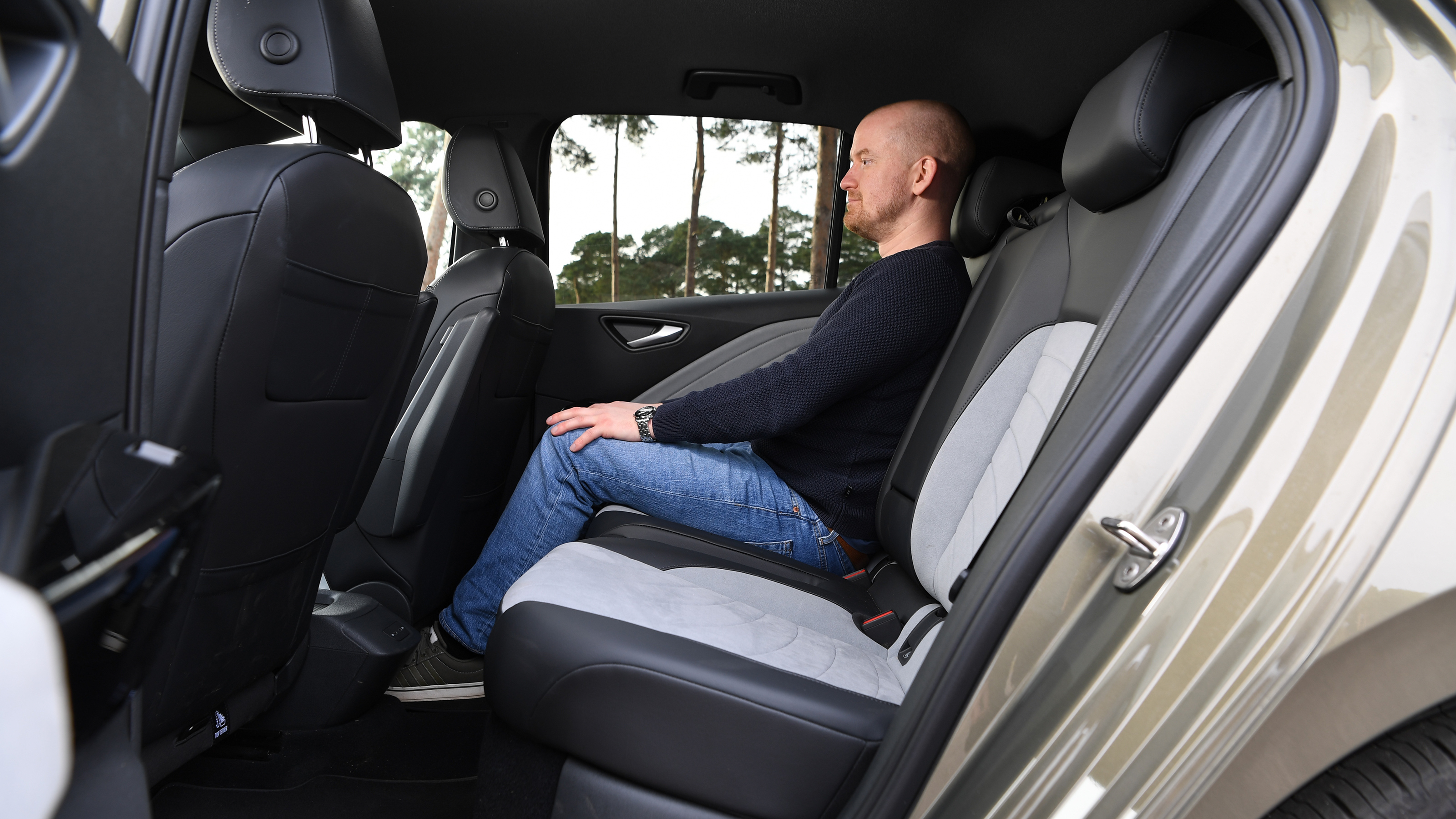 Auto Express chief reviewer Alex Ingram sitting in the Volkswagen ID.3's back seat