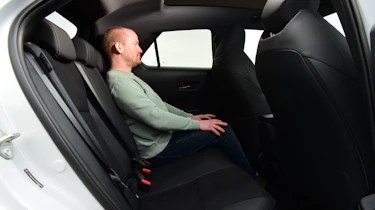 Auto Express chief reviewer Alex Ingram sitting in the Toyota C-HR'S back seat