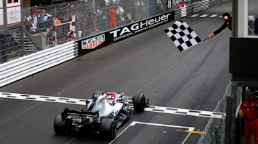 F1 car crossing the finish line