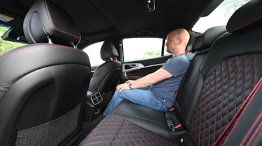 Genesis G70 - Auto Express chief reviewer Alex Ingram sitting in the Genesis G70's back seat