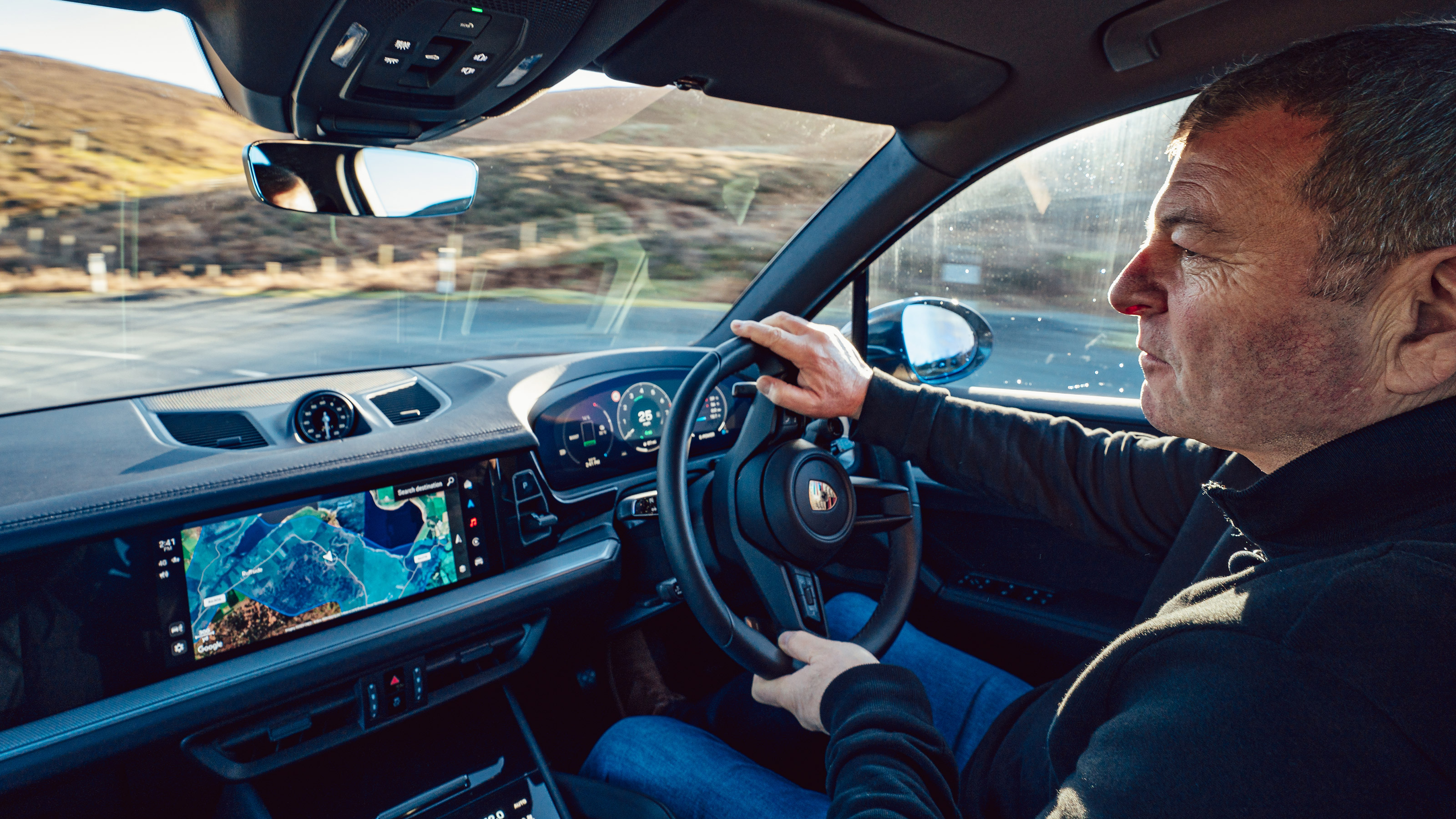 Steve Sutcliffe driving the Porsche Cayenne E-Hybrid in the UK