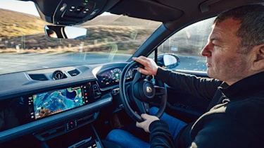 Steve Sutcliffe driving the Porsche Cayenne E-Hybrid in the UK