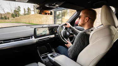 Alex Ingram driving the BMW iX2 xDrive30 M Sport