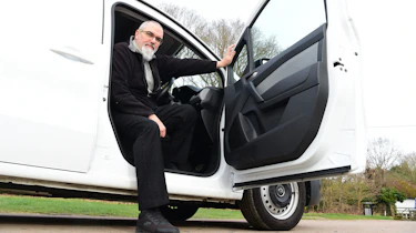 Auto Express senior road test editor Dean Gibson leaning out of the Renault Kangoo's driver's door