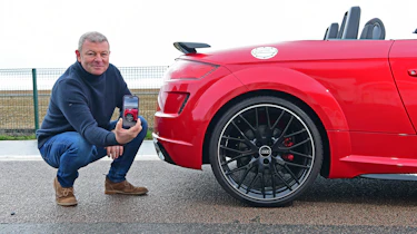 Auto Express contributing editor Steve Sutcliffe potining at the Audi TT Roadster Final Edition's rear bumper