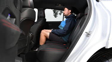 Auto Express photographer Otis Clay sitting in the Mercedes GLA's back seat
