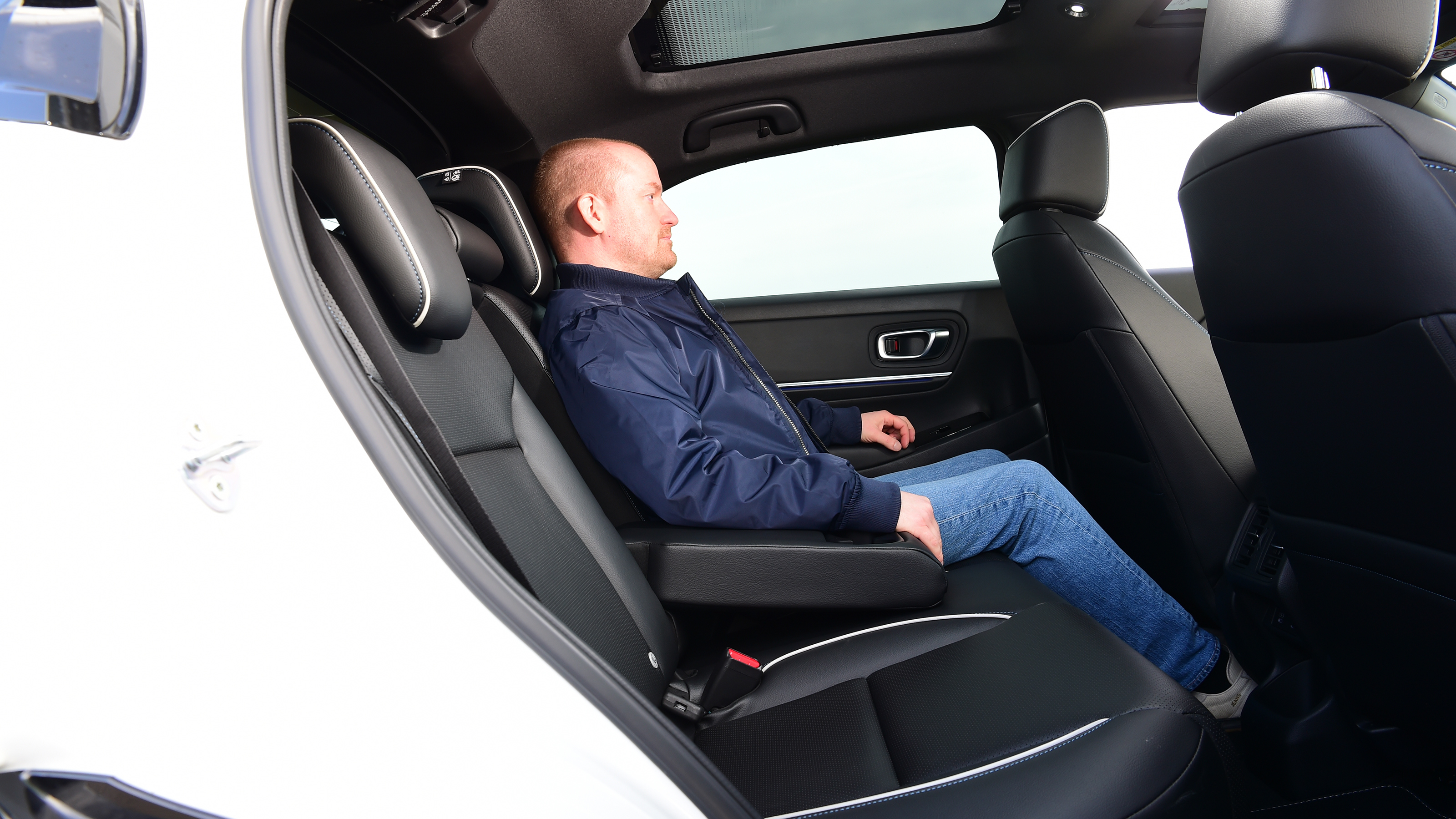 Honda e:Ny1 vs Hyundai Kona Electric - Honda e:Ny1 rear seats with Auto Express chief reviewer, Alex Ingram