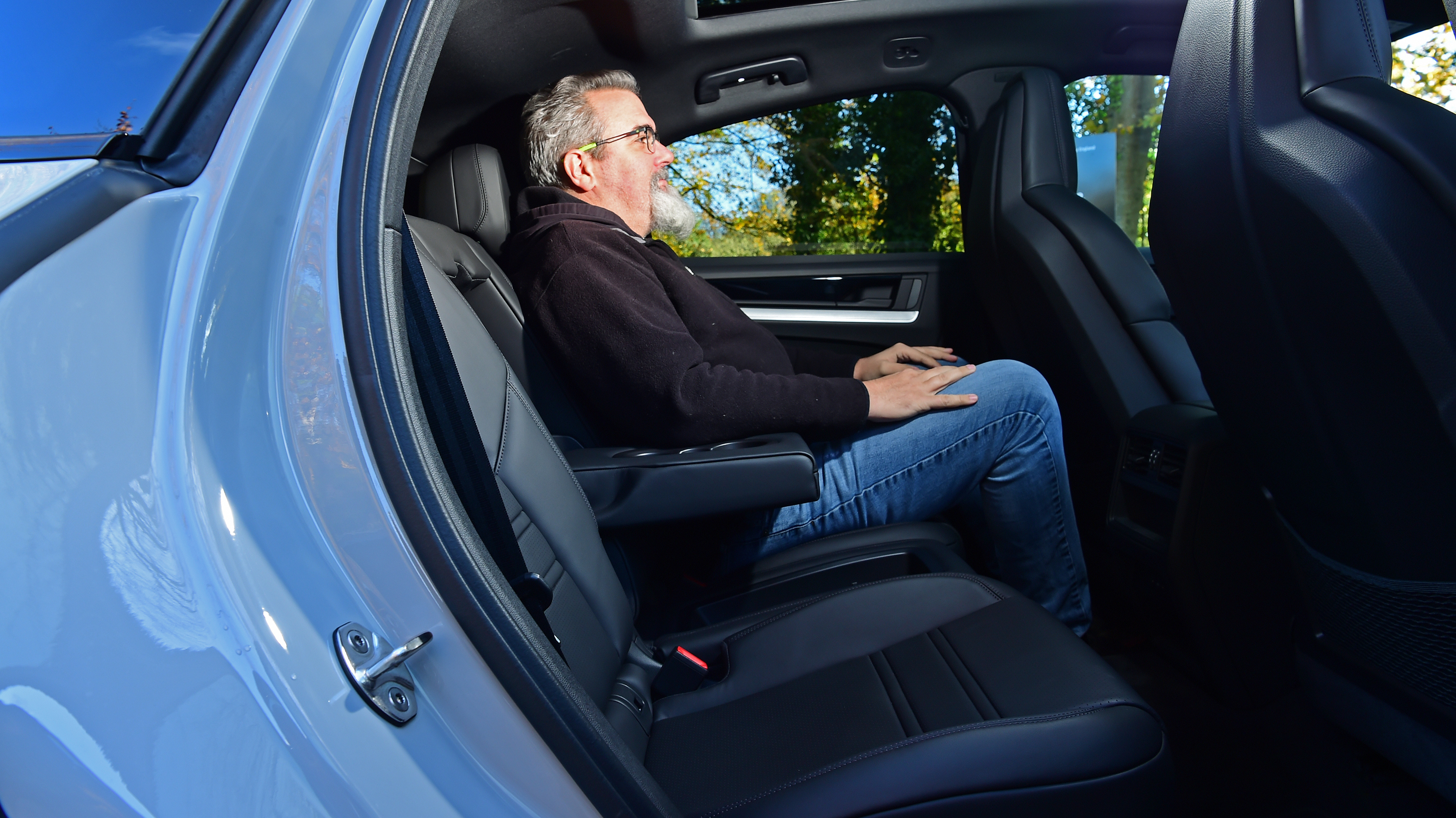 Porsche Cayenne vs BMW X5 - Porsche Cayenne rear seats with Auto Express senior test editor, Dean Gibson 