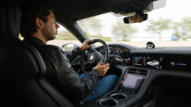 Yousuf Ashraf driving the Porsche Taycan 4S facelift