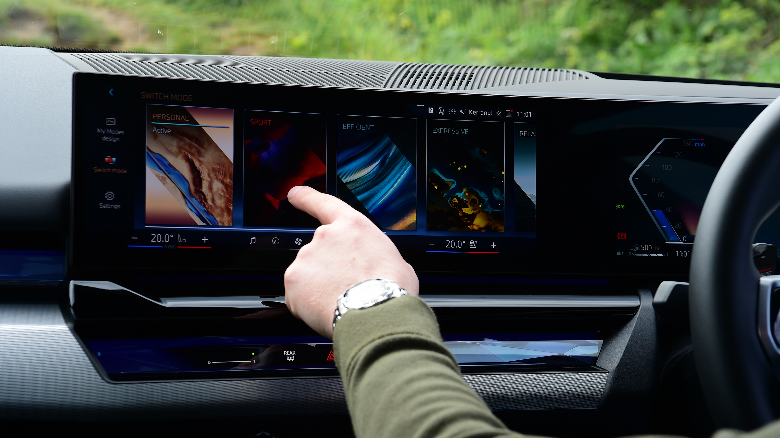 Auto Express chief reviewer operating the BMW 530e's infotainment sytem
