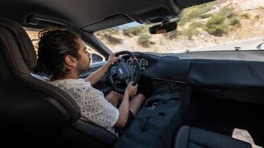 Auto Express senior staff writer Jordan Katsianis driving the Audi e-tron GT prototype
