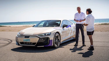 Auto Express senior staff writer Jordan Katsianis standing next to the Audi e-tron GT prototype