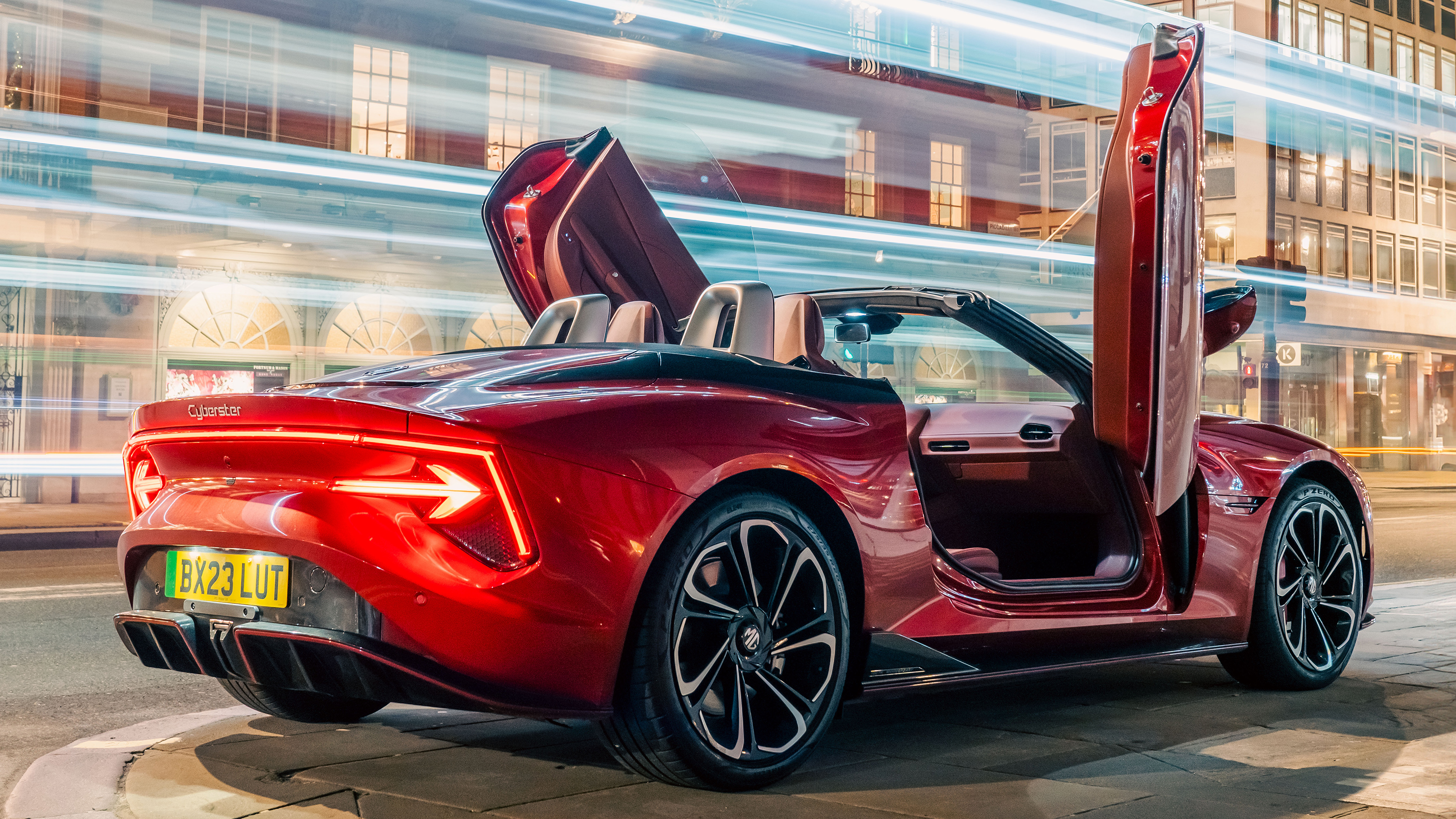 New MG Cyberster - rear 3/4 red with doors up
