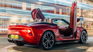 New MG Cyberster - rear 3/4 red with doors up