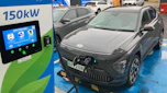Hyundai Kona Electric connected to a rapid-charging station