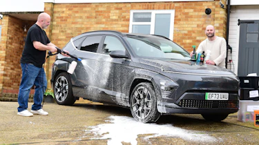 Auto Express creative director Darren Wilson washing the Hyundai Kona Electric