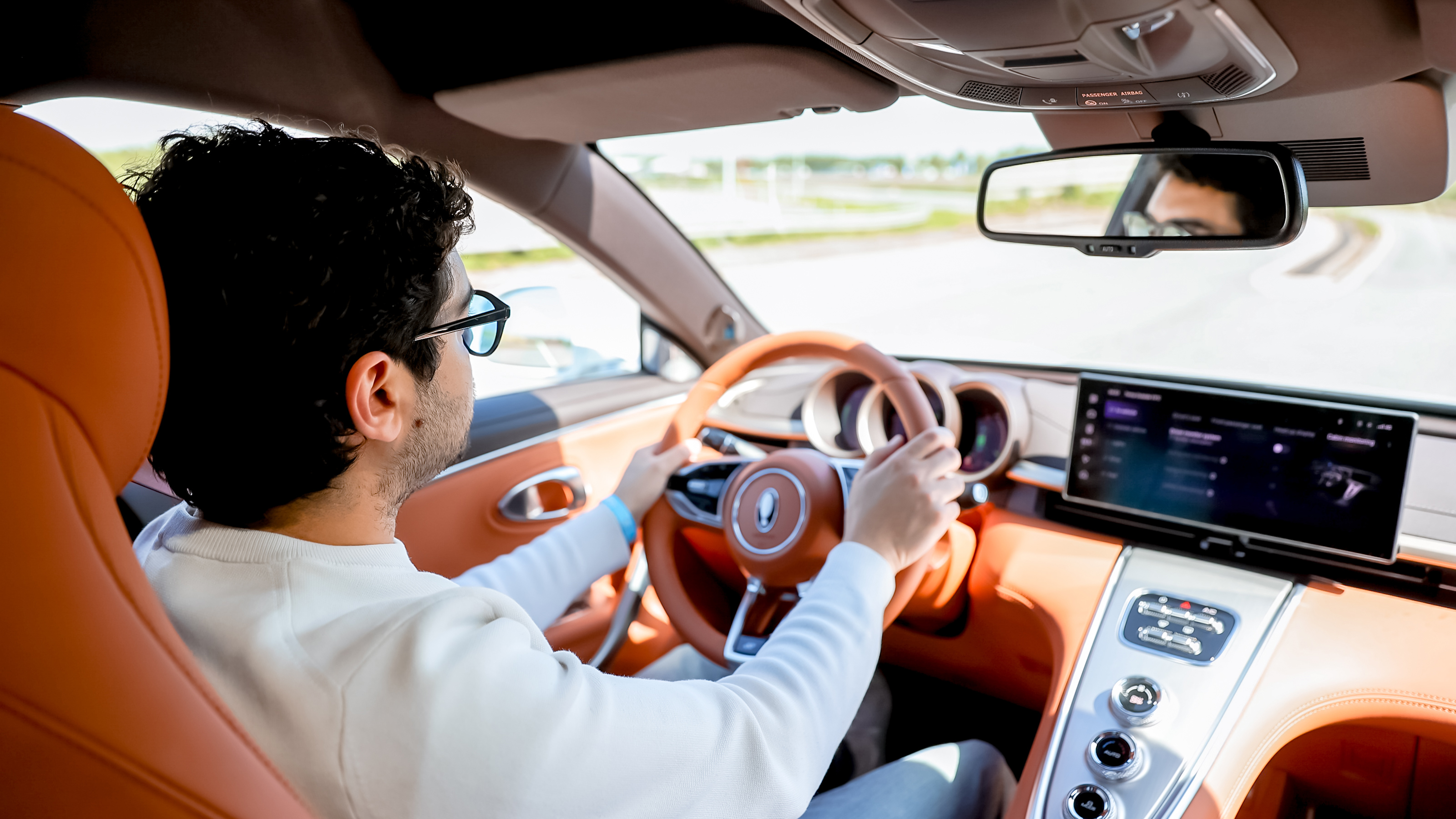 New ORA 07 - interior driving shot with Auto Express senior staff writer Jordan Katsianis