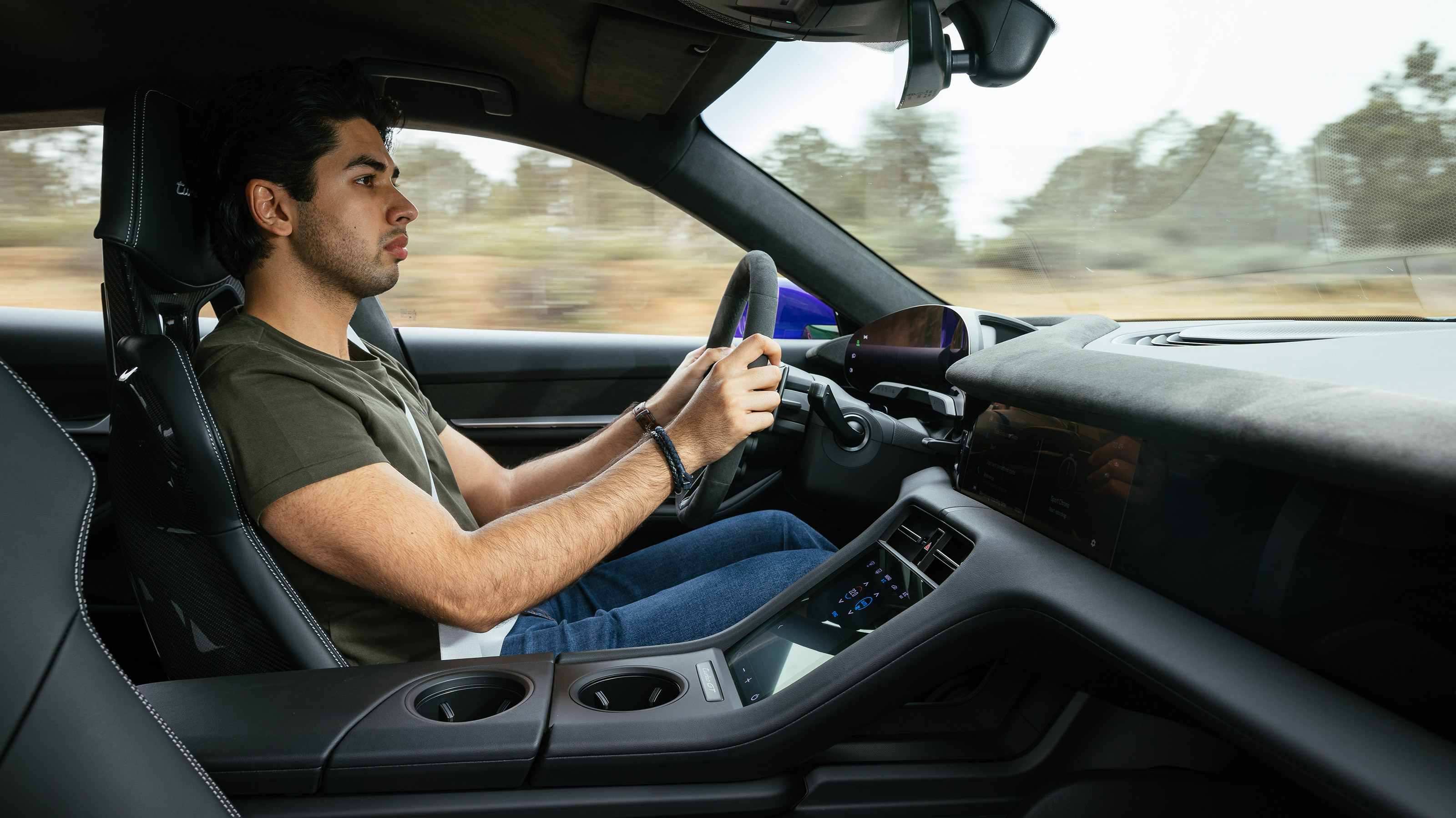 Yousuf Ashraf driving the Porsche Taycan Turbo GT