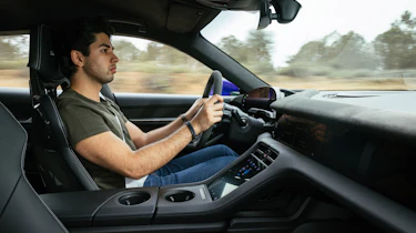 Yousuf Ashraf driving the Porsche Taycan Turbo GT