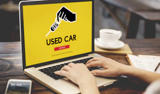 "Used car" graphic on laptop