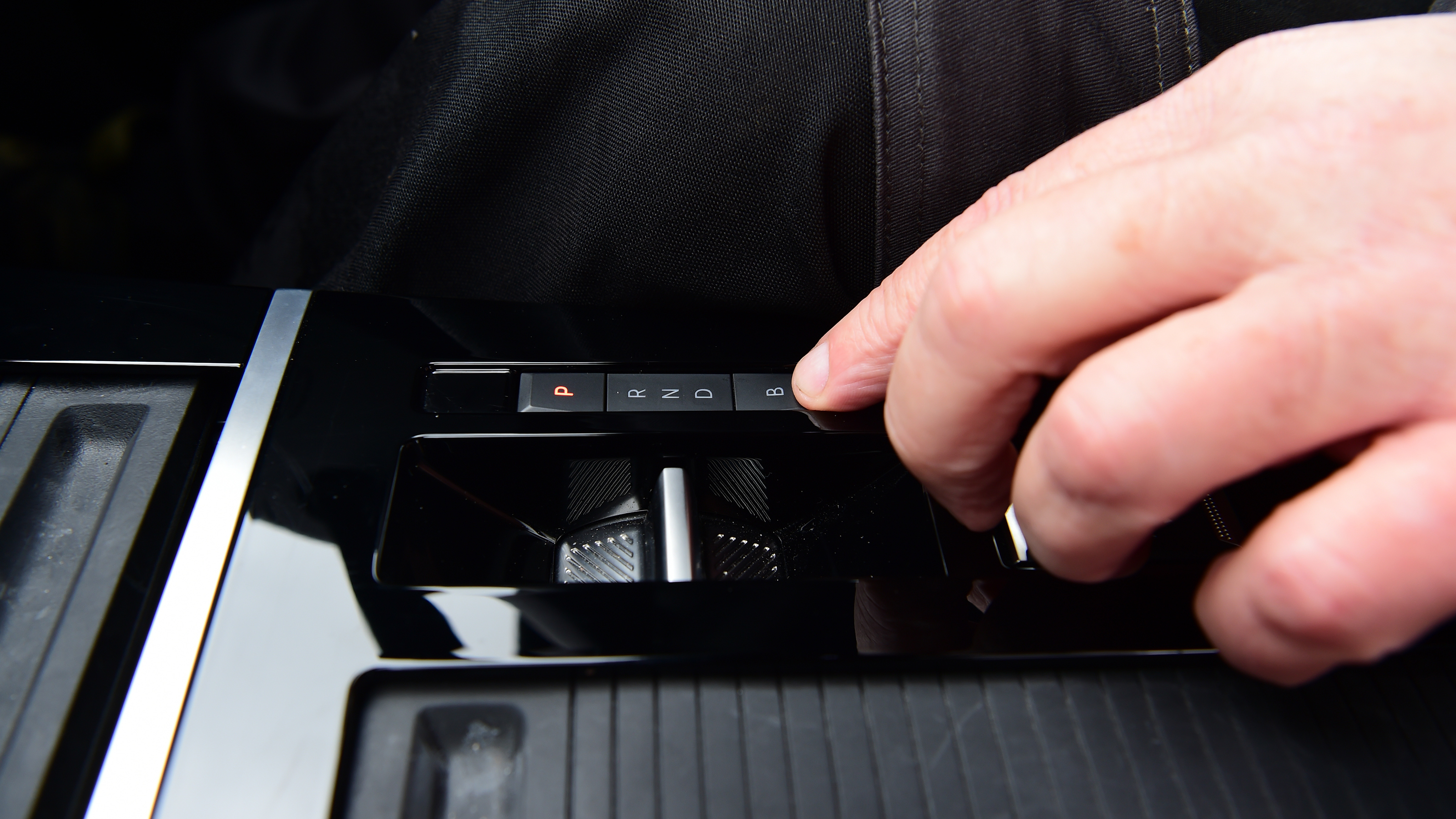 Auto Express products editor Kim Adams operating the Vauxhall Astra GSe's gear selector