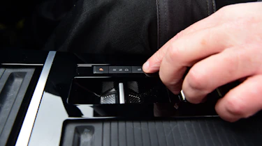 Auto Express products editor Kim Adams operating the Vauxhall Astra GSe's gear selector