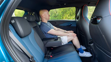 Auto Epress chief reviewer Alex Ingram sitting in the BYD Dolphin's back seat