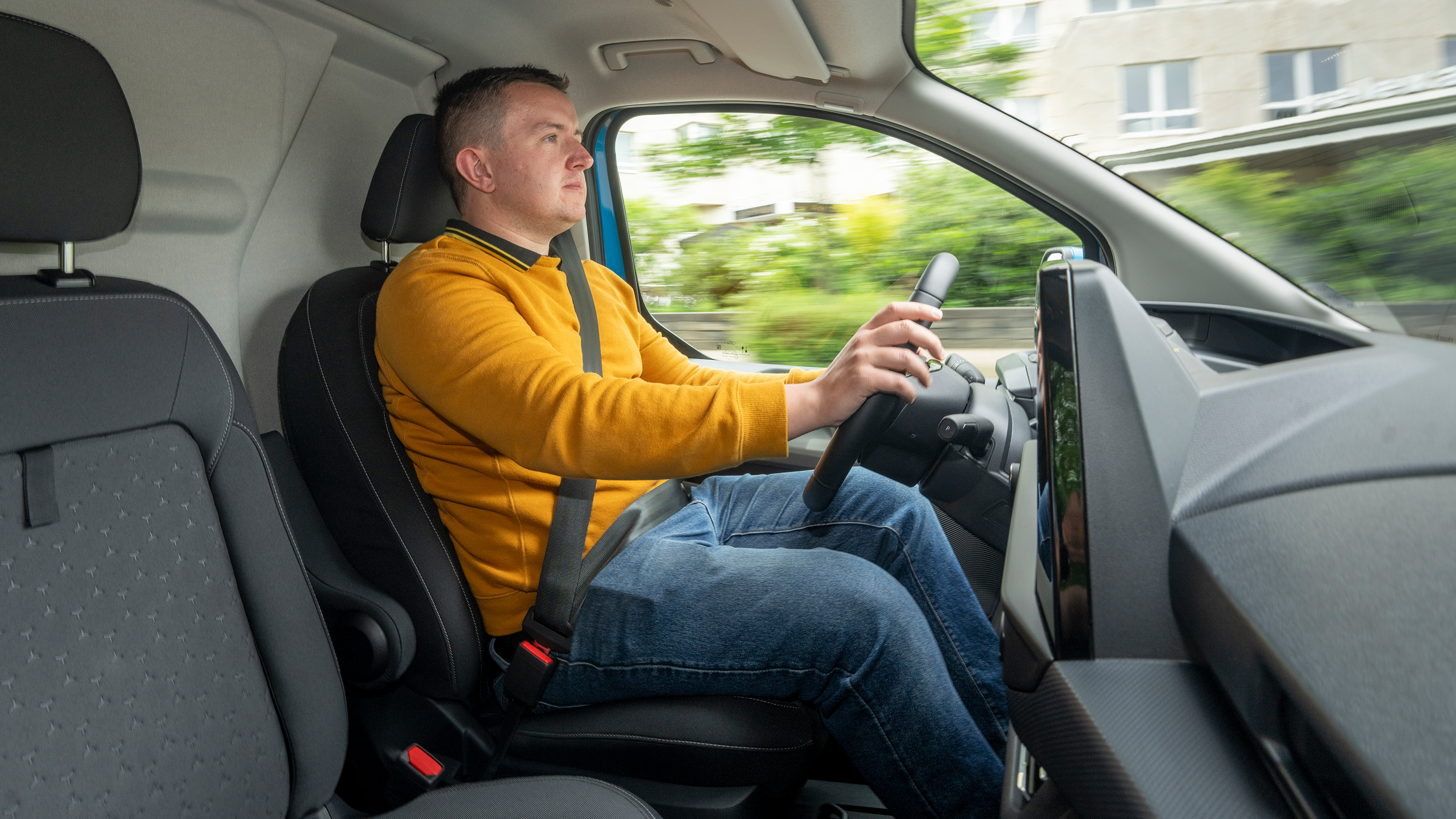 Auto Express senior content editor Shane Wilkinson driving the Ford E-Transit Custom