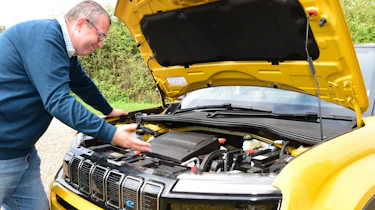 Auto Express editor-at-large John McIlroy inspecting the Jeep Avenger's engine bay