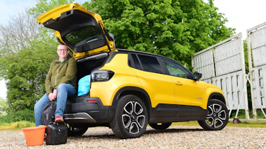 Auto Express editor-at-large John McIlroy sitting in the Jeep Avenger's boot