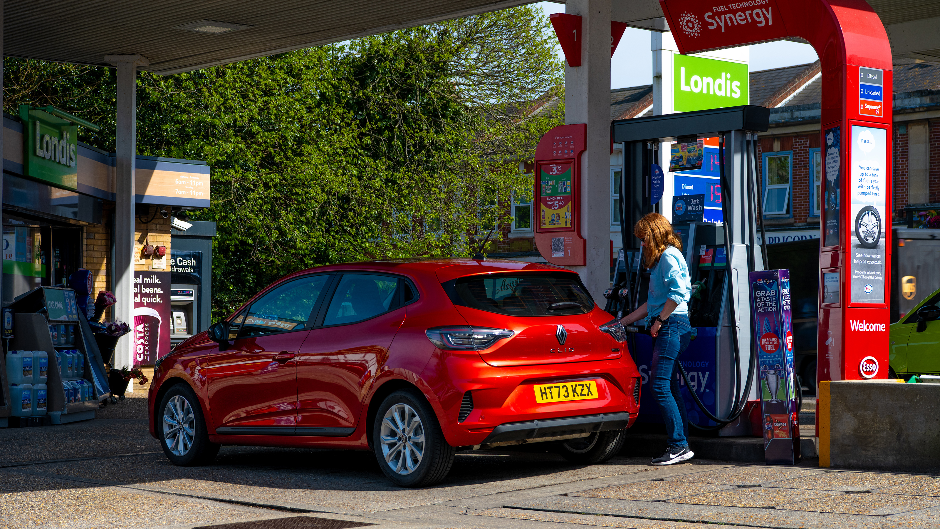Auto Express pictures editor Dawn Grant refuelling the Renault Clio