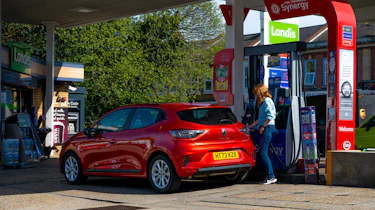 Auto Express pictures editor Dawn Grant refuelling the Renault Clio