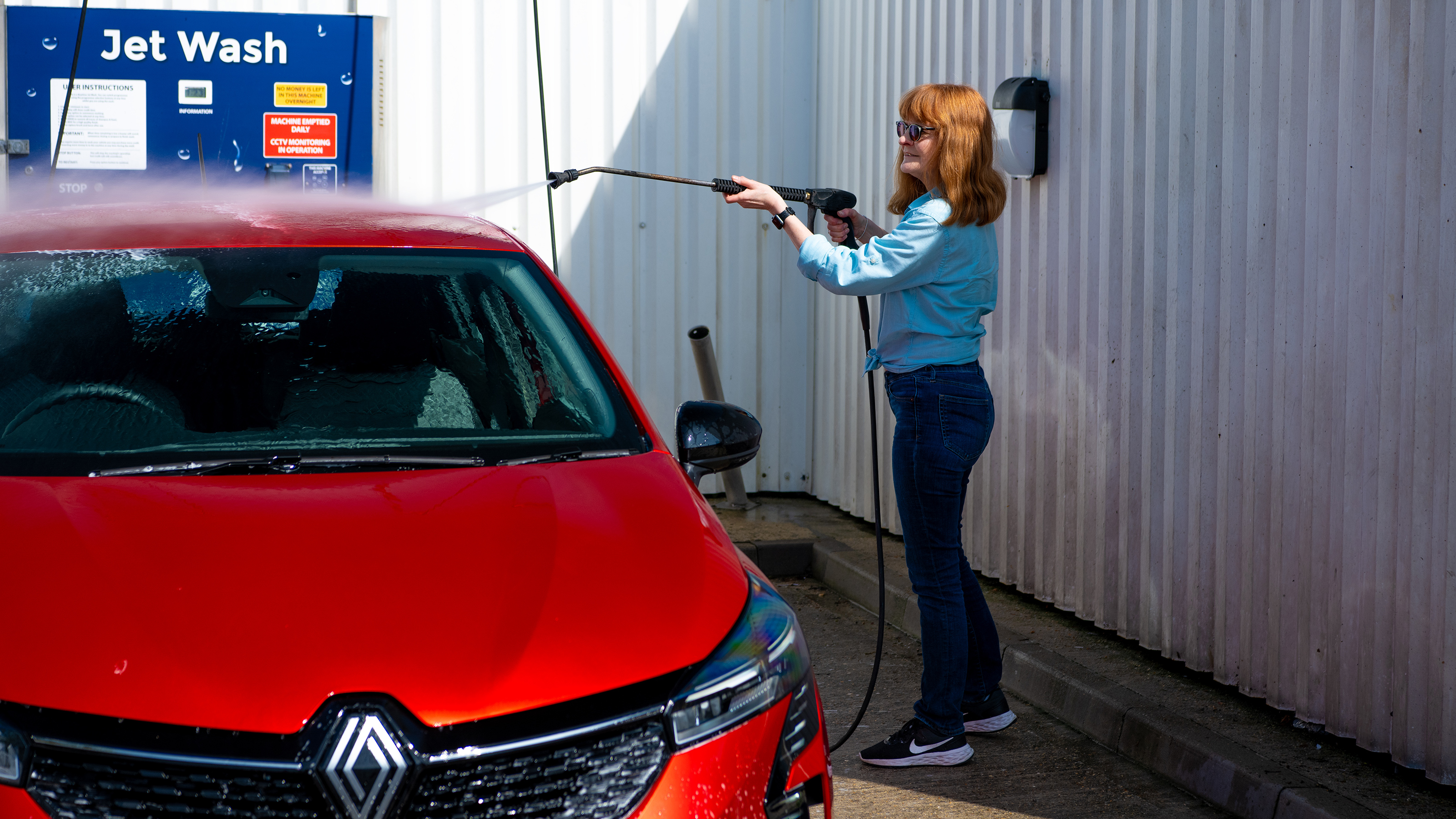 Auto Express pictures editor Dawn Grant washing the Renault Clio