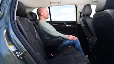 Auto Express chief reviewer Alex Ingram sitting in the Volkswagen Tiguan's back seat