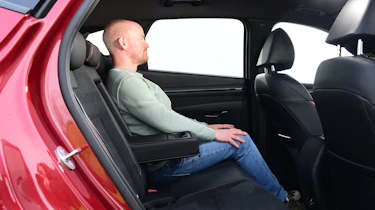 Auto Express chief reviewer Alex Ingram sitting in the Hyundai Tucson's back seat