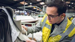 Auto Express consumer reporter Tom Jervis inspecting a sample of leather