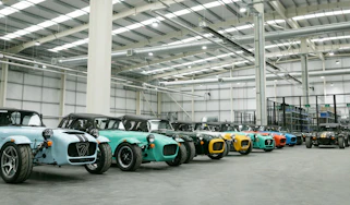 Multiple Caterhams parked in factory