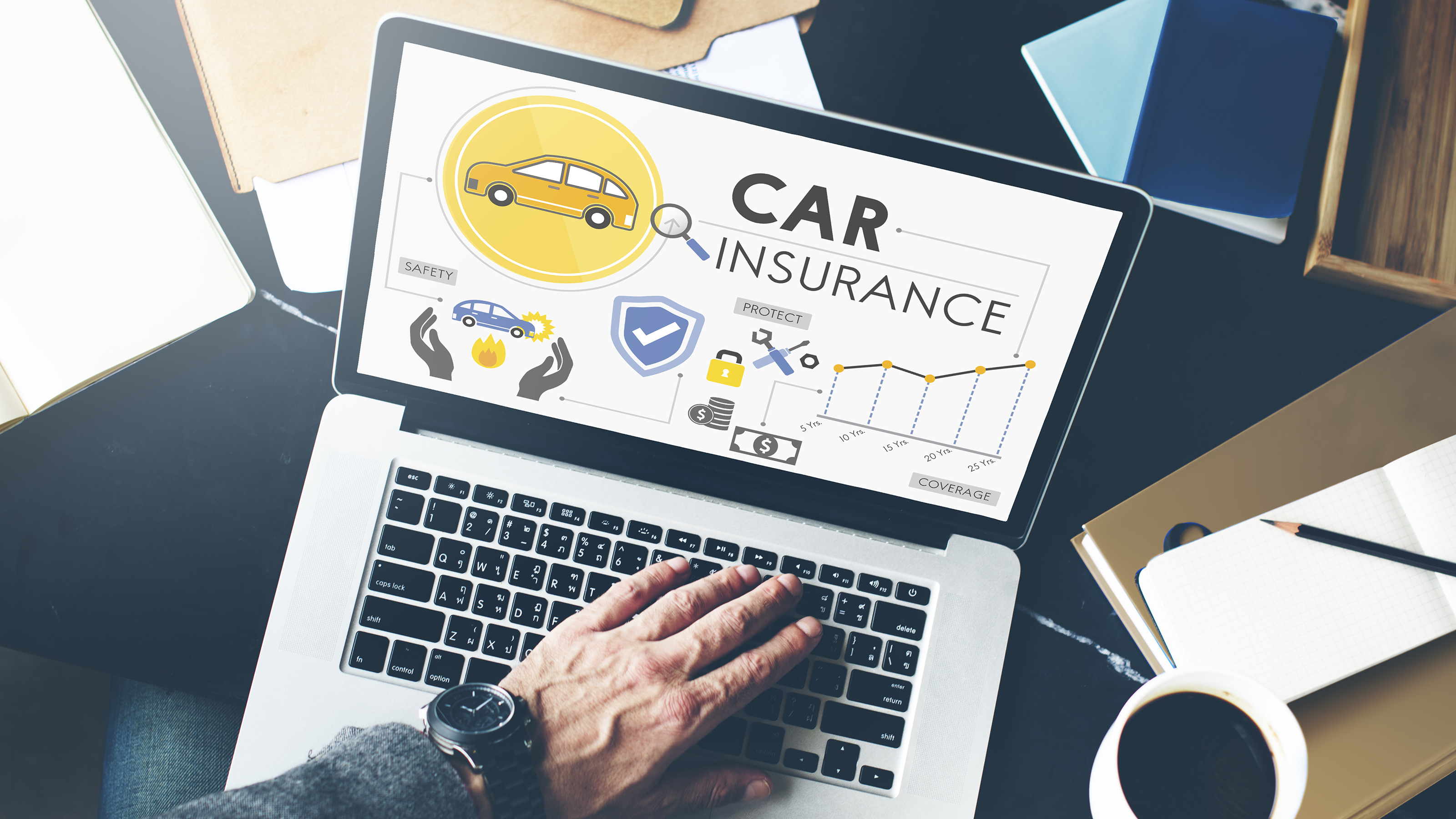 Person searching for car insurance on a laptop