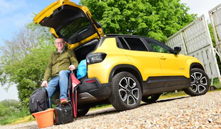 Auto Express editor-at-large John McIlroy sitting in the Jeep Avenger's boot