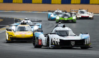 Le Mans racing cars on the Dunlop Chicane