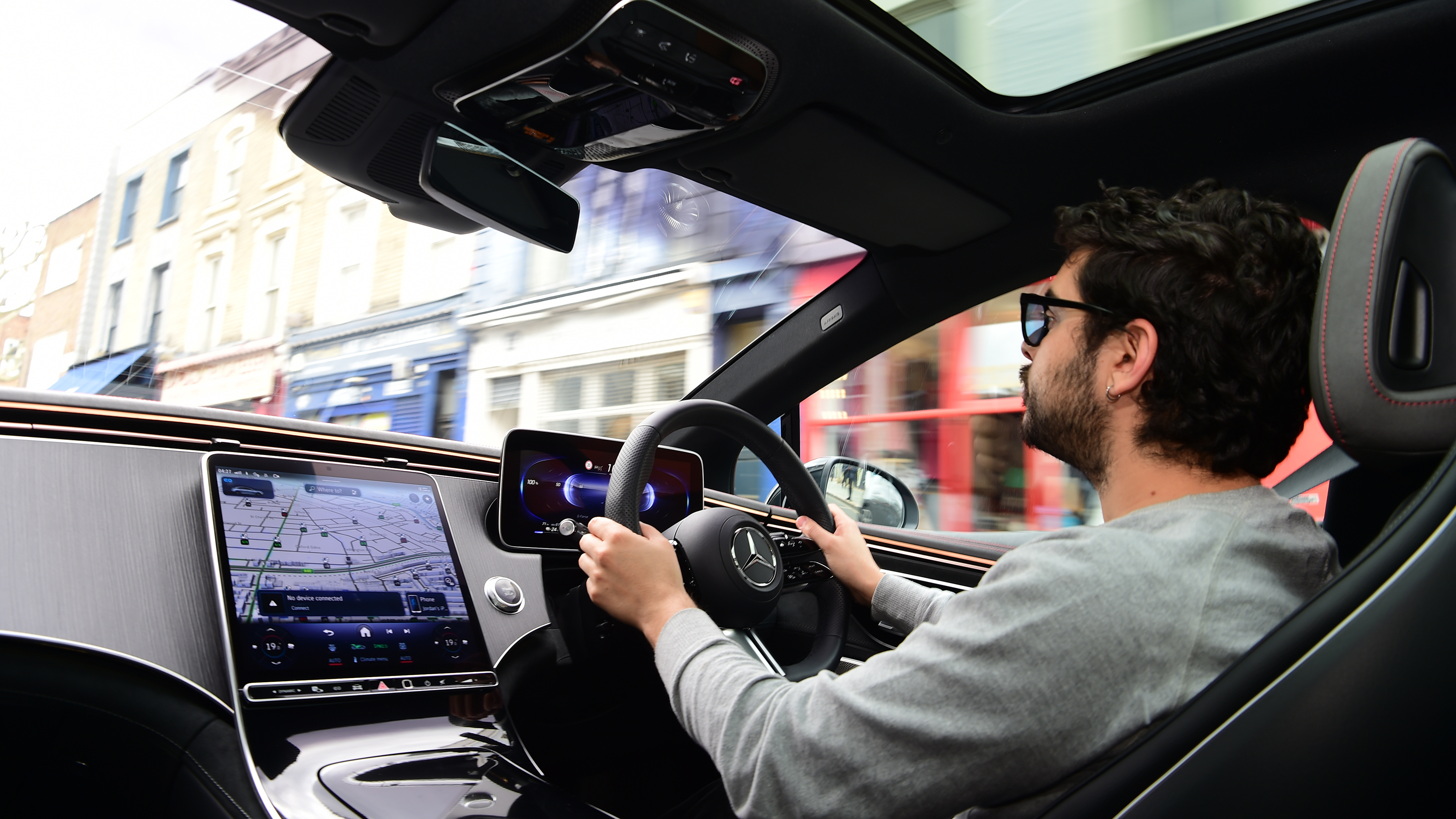 Auto Express senior staff writer Jordan Katsianis driving the Mercedes EQE