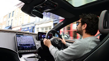 Auto Express senior staff writer Jordan Katsianis driving the Mercedes EQE